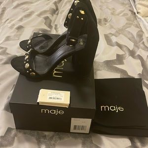 Maje heels with gold studs.